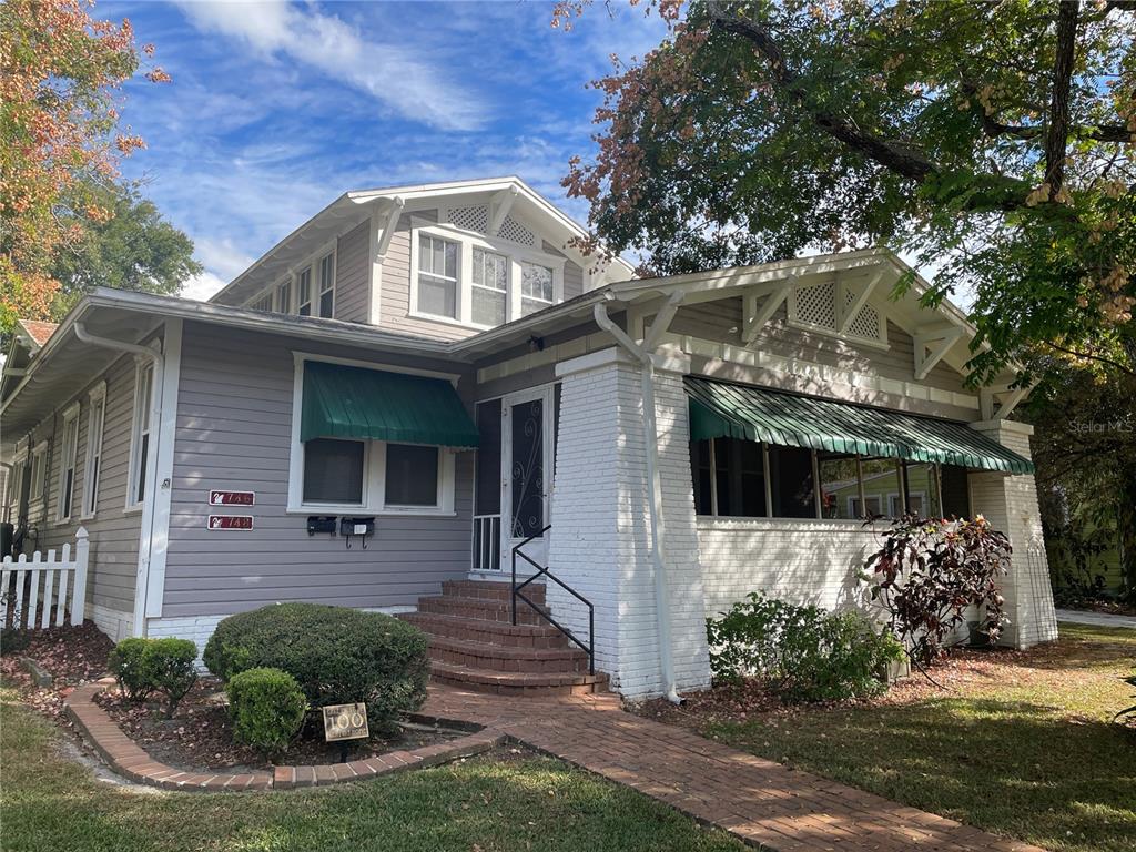 a front view of a house with garden