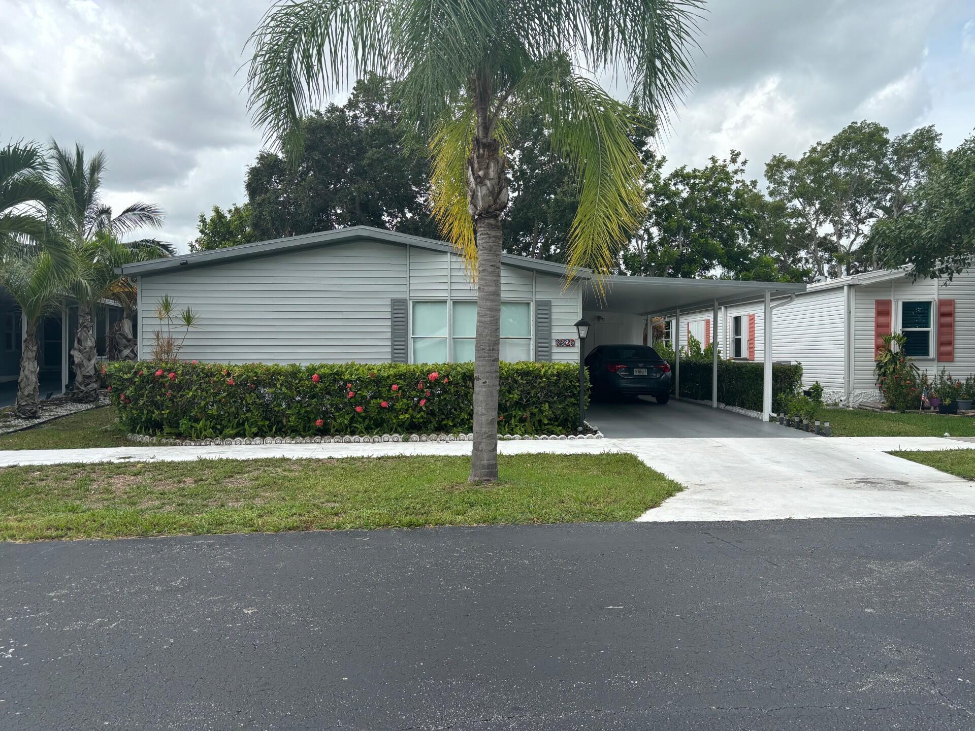 a house that has a tree in front of it