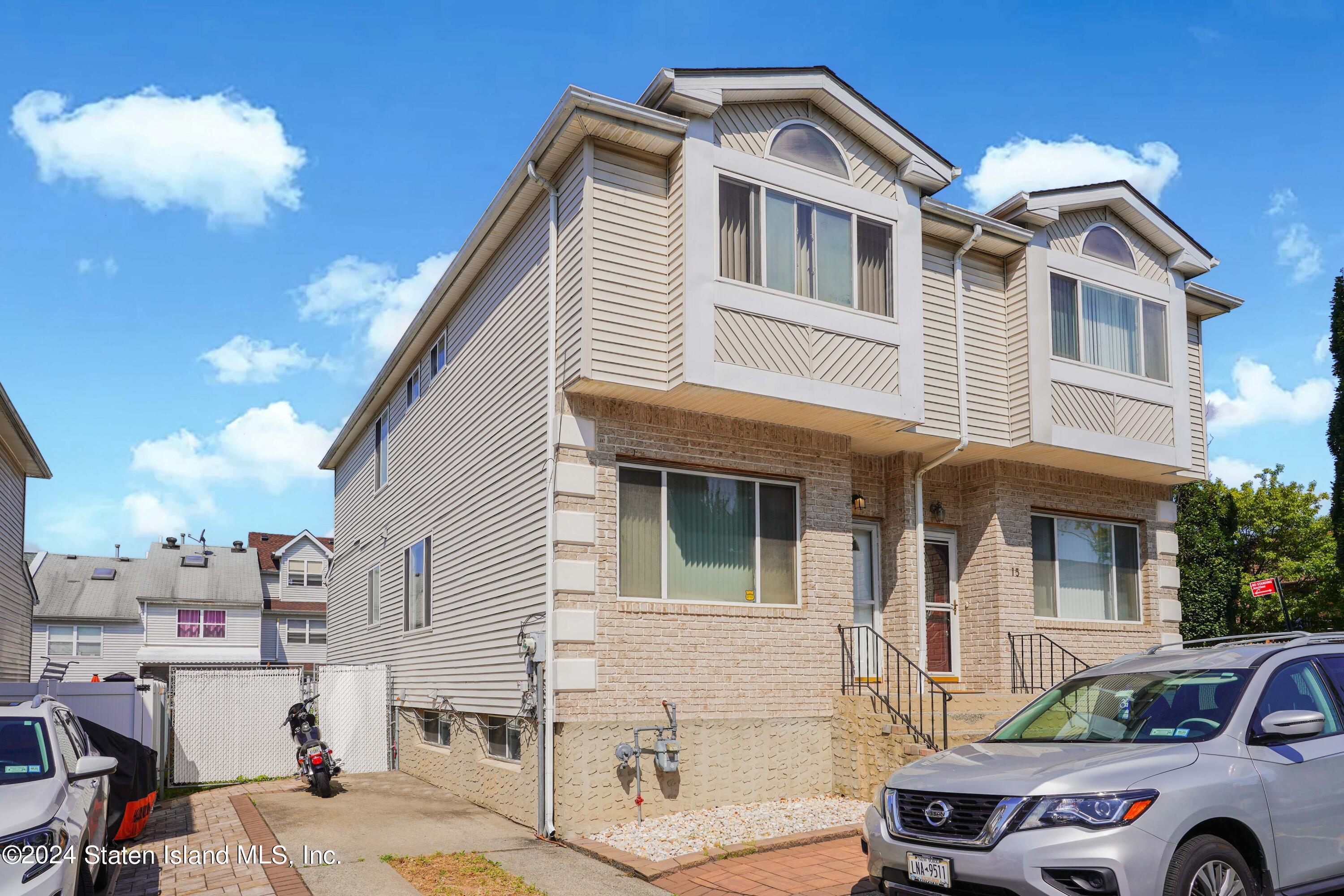 a front view of a house with parking