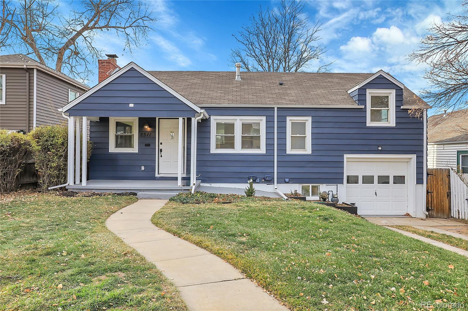 a view of a house with a yard