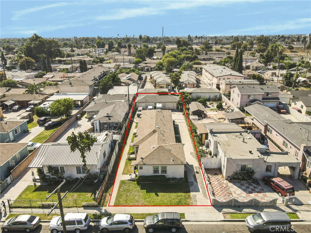 an aerial view of residential houses with city view