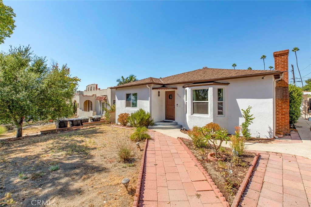 a front view of a house with a patio