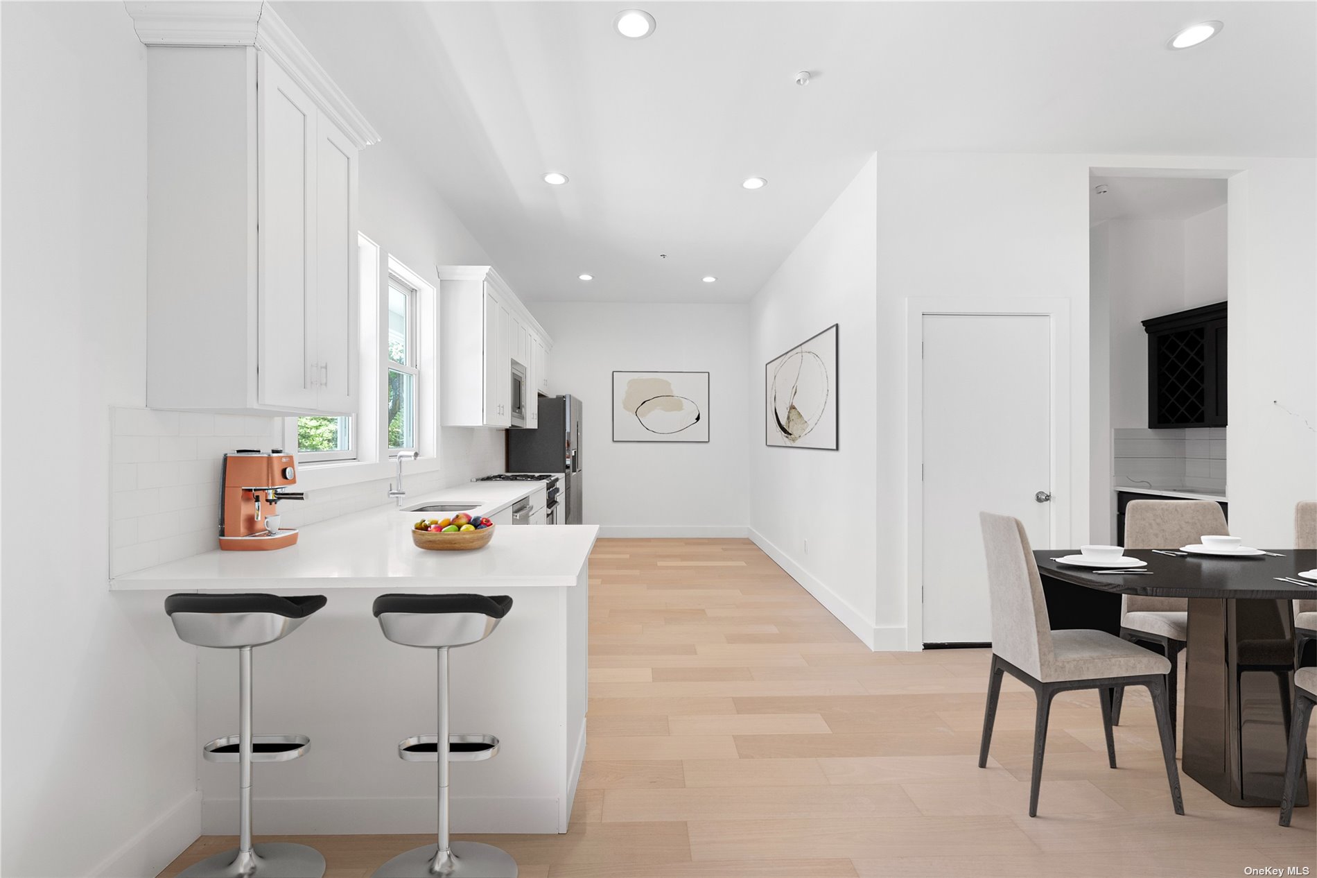 a view of kitchen with cabinets and wooden floor