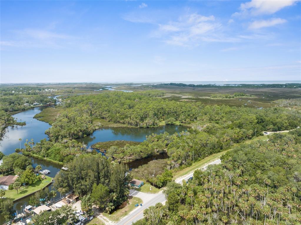 a view of lake with green space