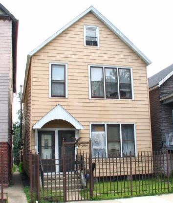 a front view of a house with glass windows