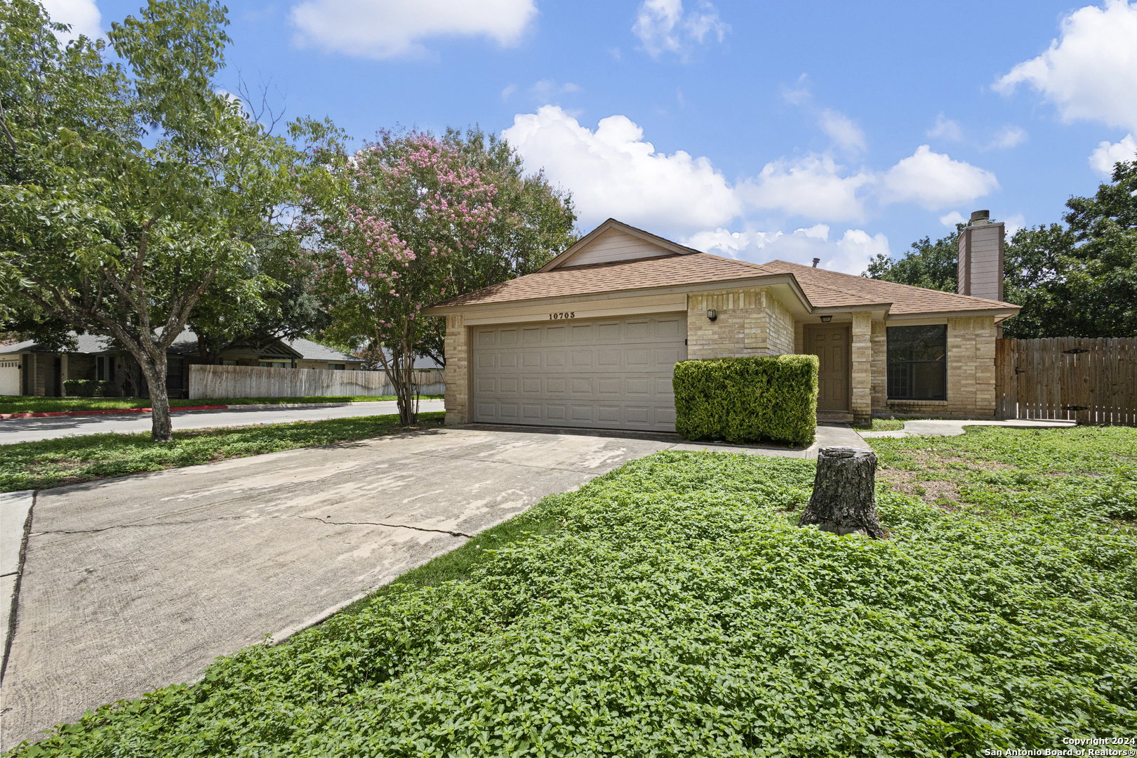 front view of a house with a yard