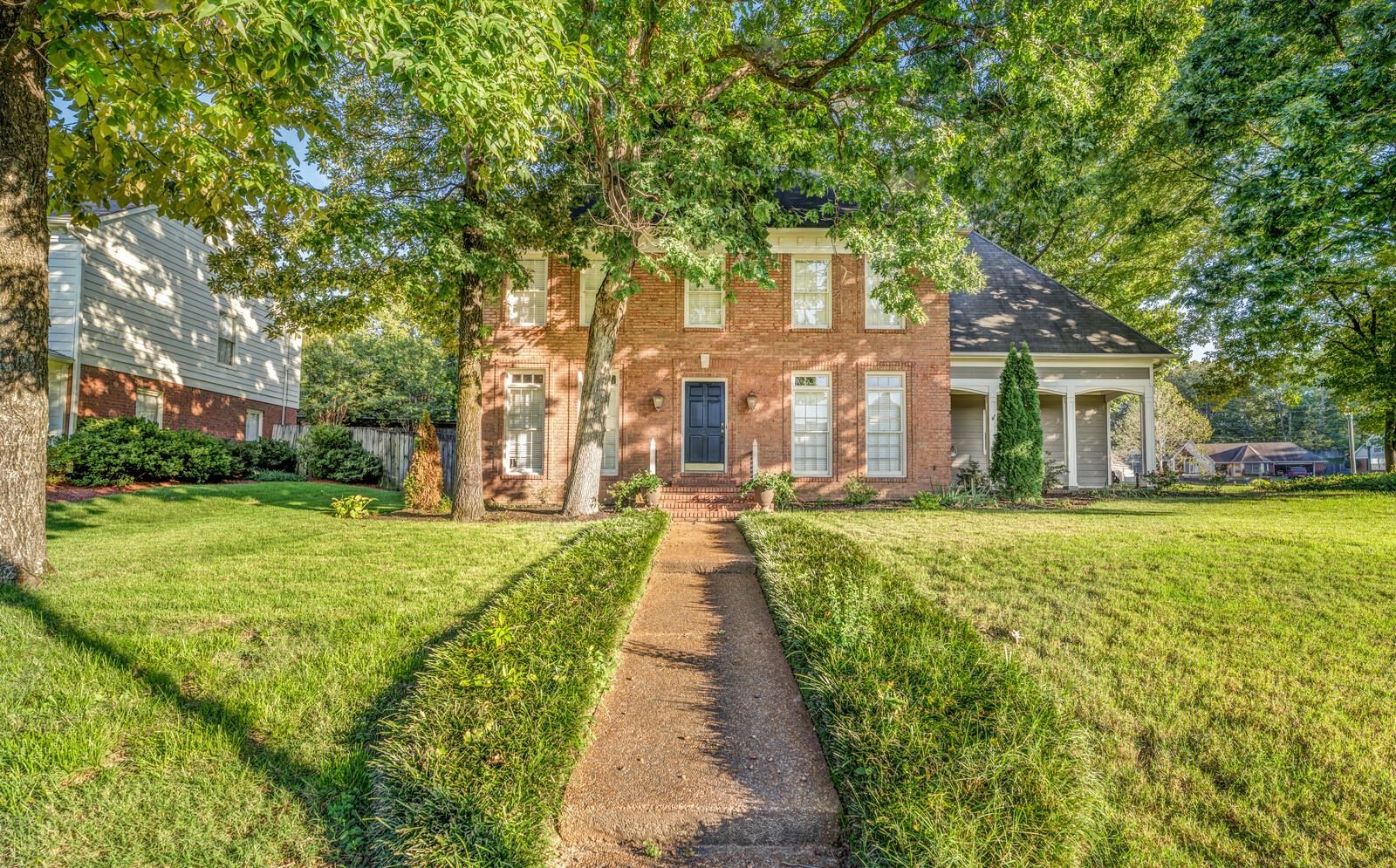 a house with garden in front of it