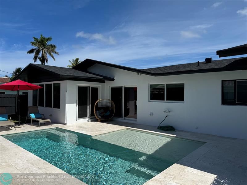 a view of house with yard and entertaining space