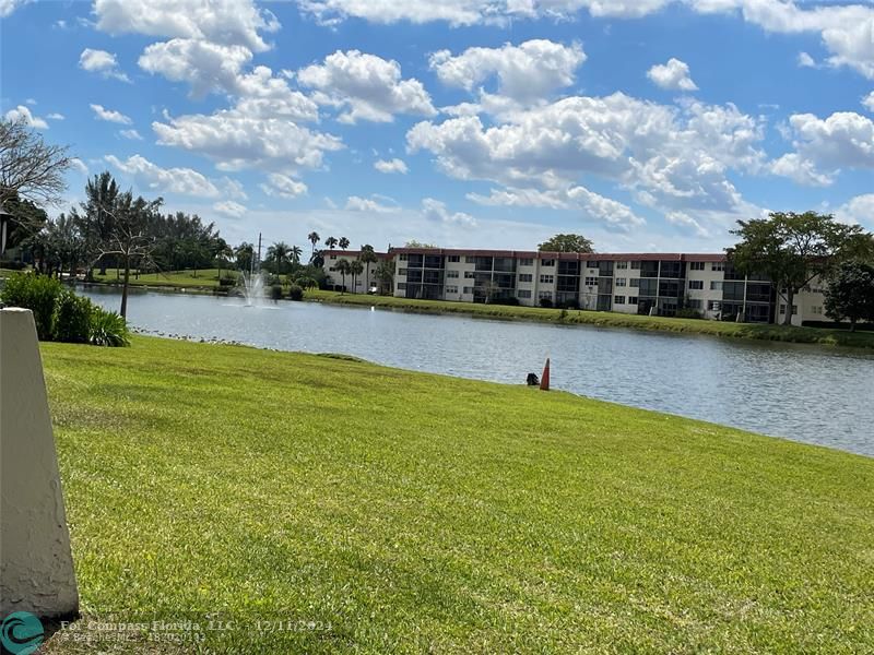 a view of a lake with houses in the back