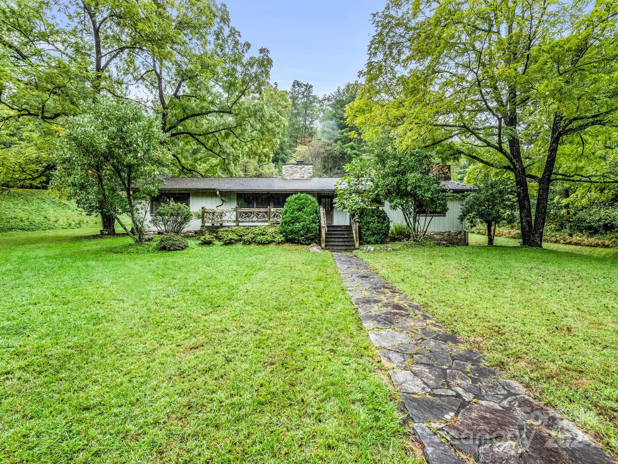 a view of a house with a big yard