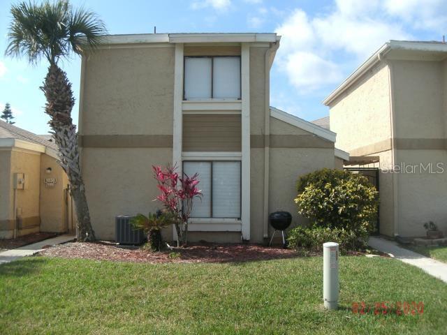 a front view of a house having yard