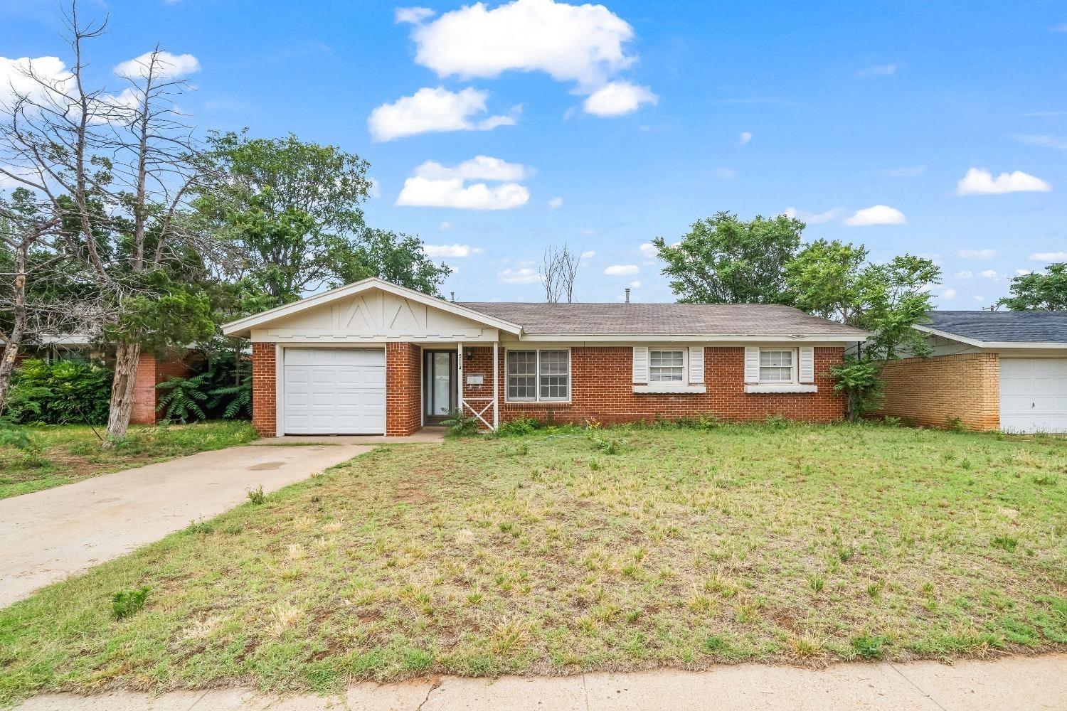 a front of a house with a yard