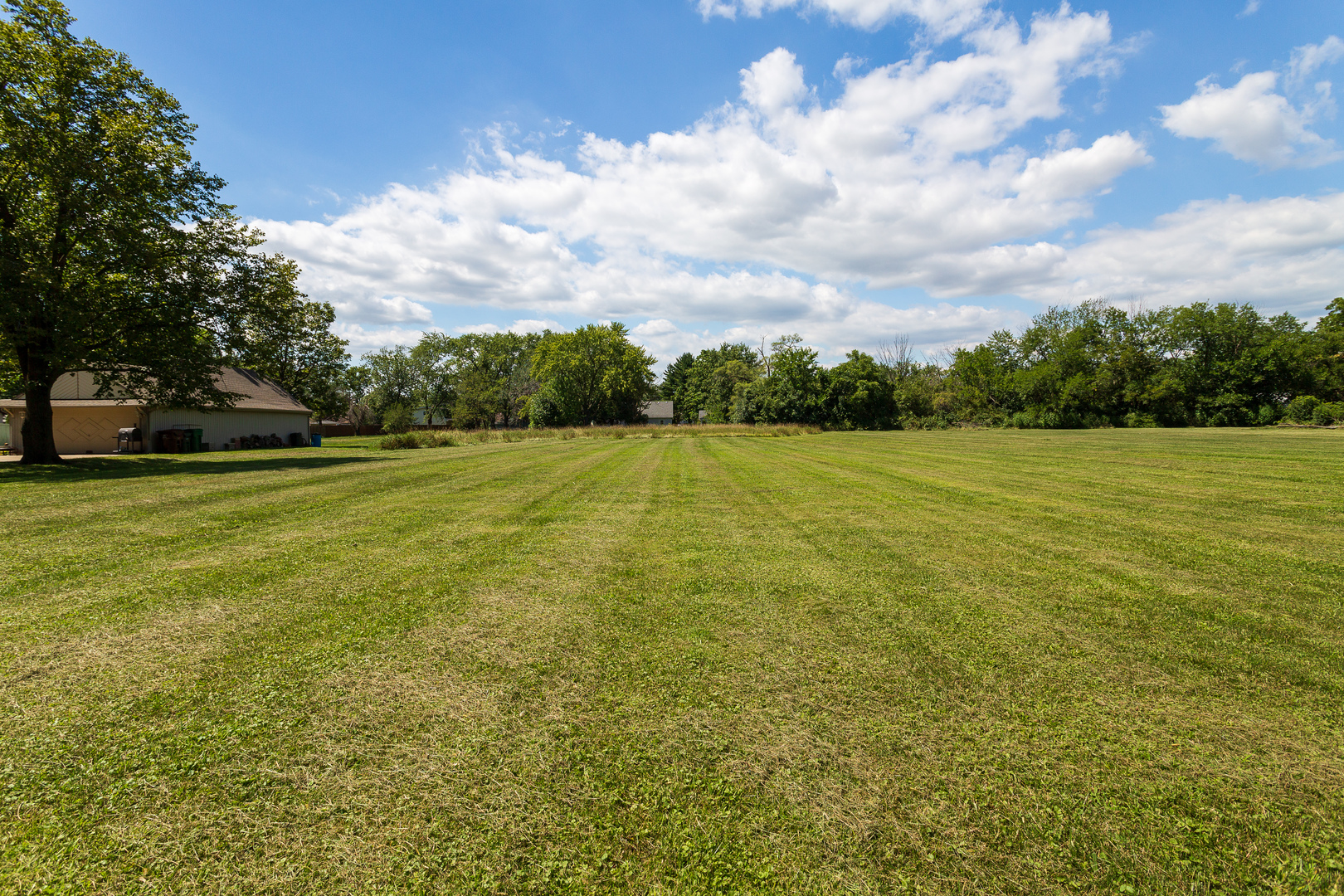 a view of a field with an outdoor space