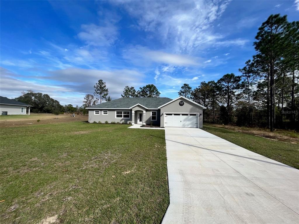 front view of a house with a yard