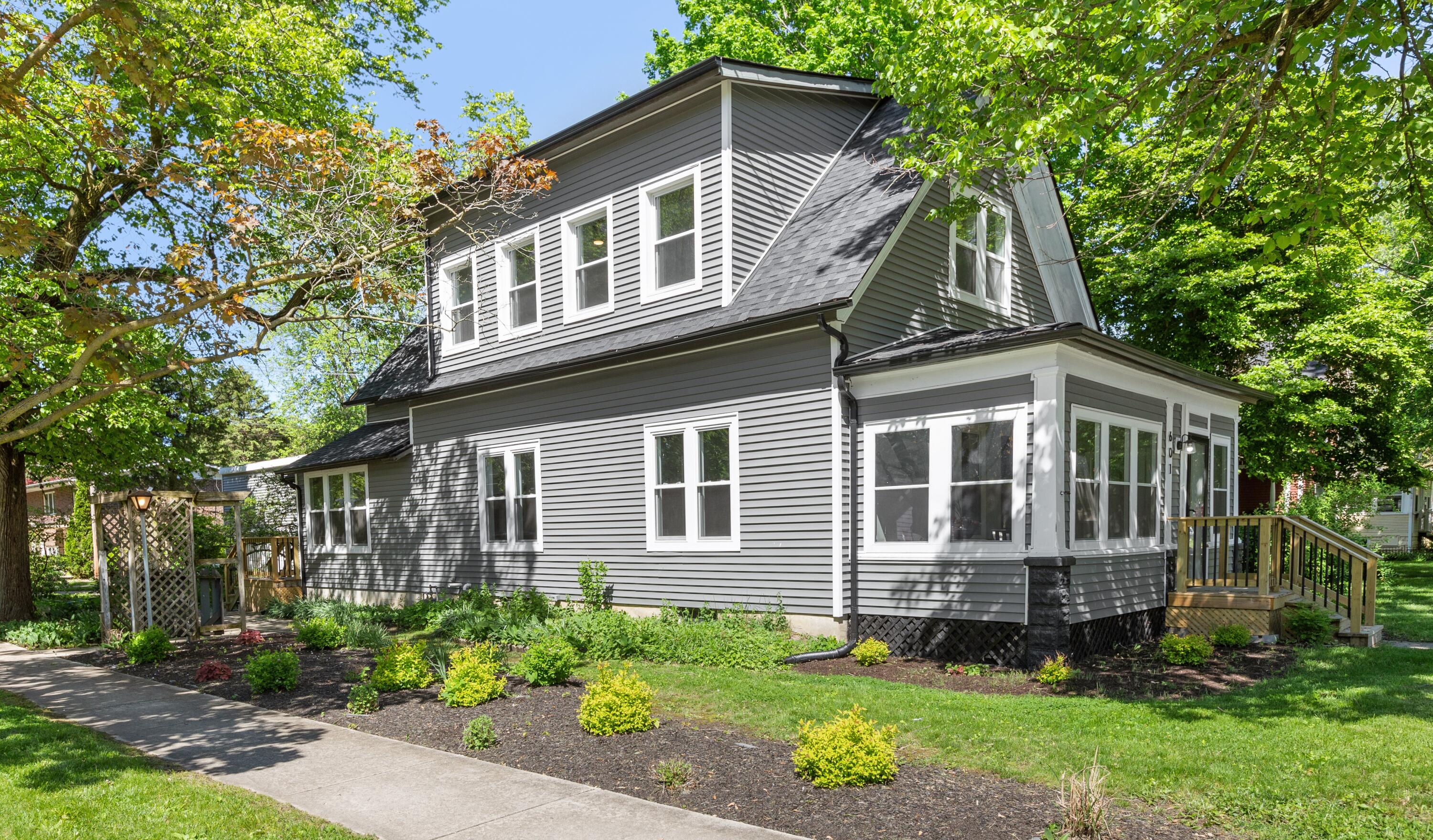 a front view of a house with garden