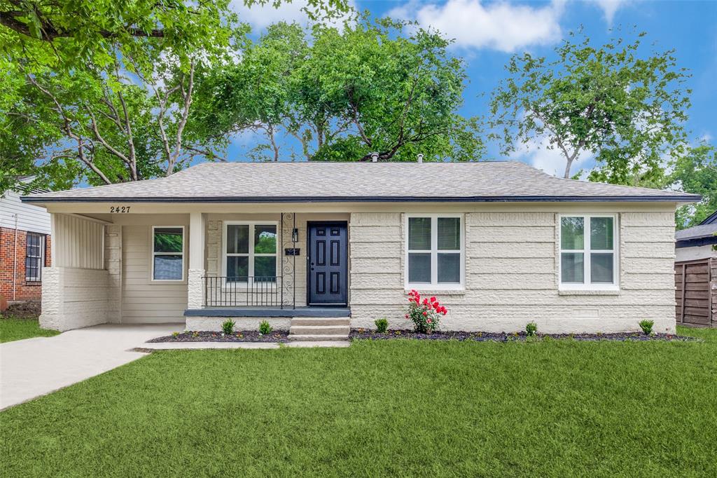 front view of a house with a yard