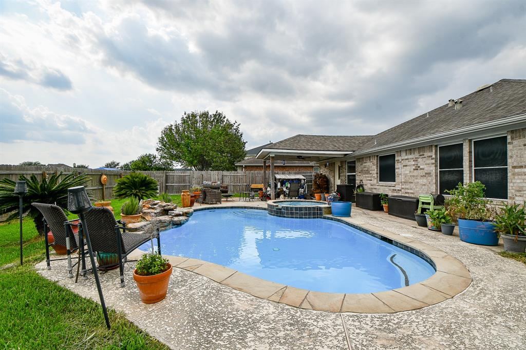 a view of a swimming pool with lounge chair