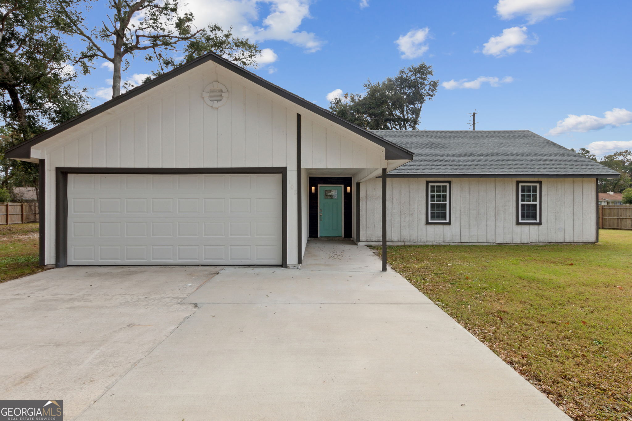 a house with yard in front of it