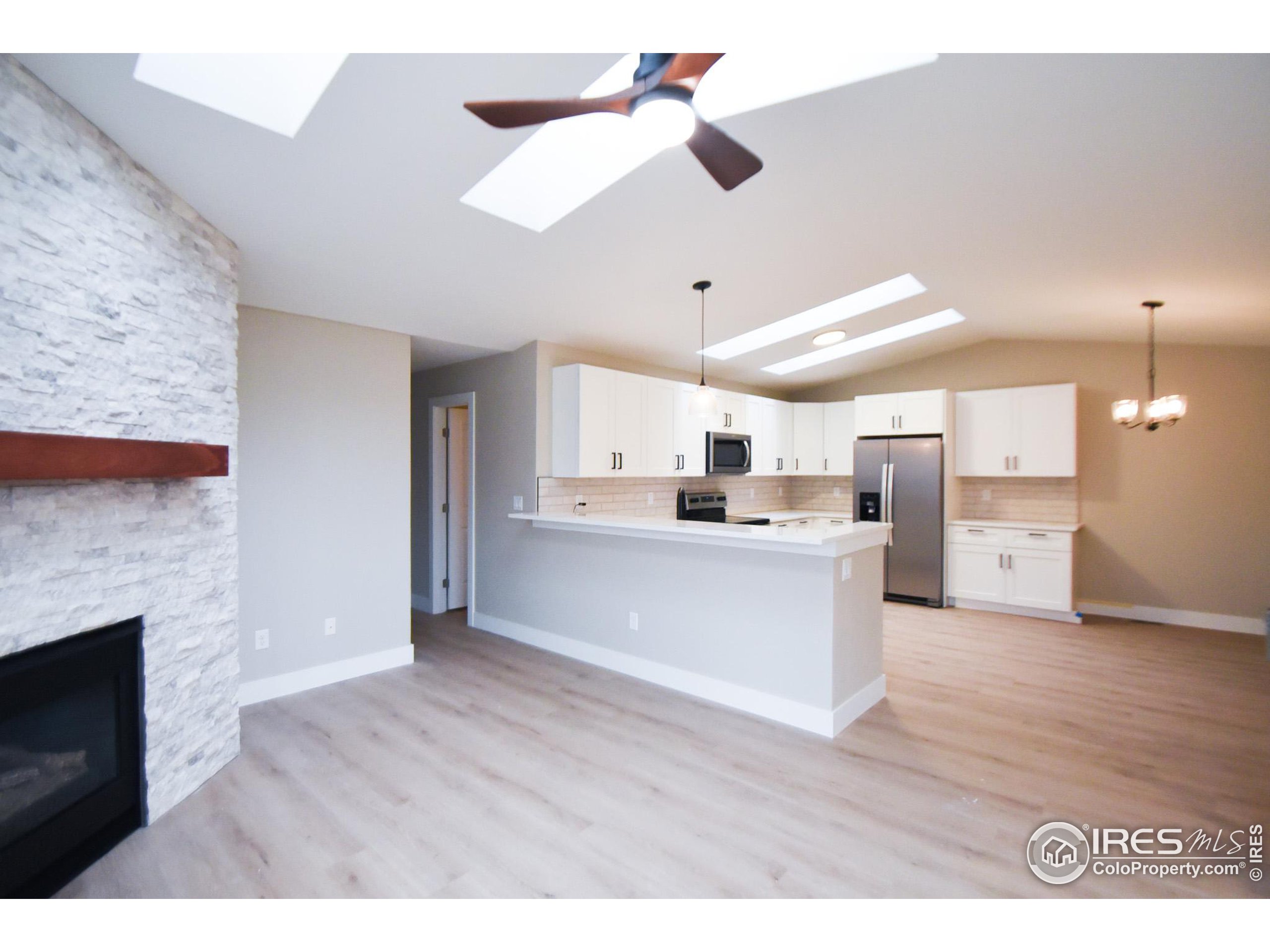 a view of kitchen with wooden floor