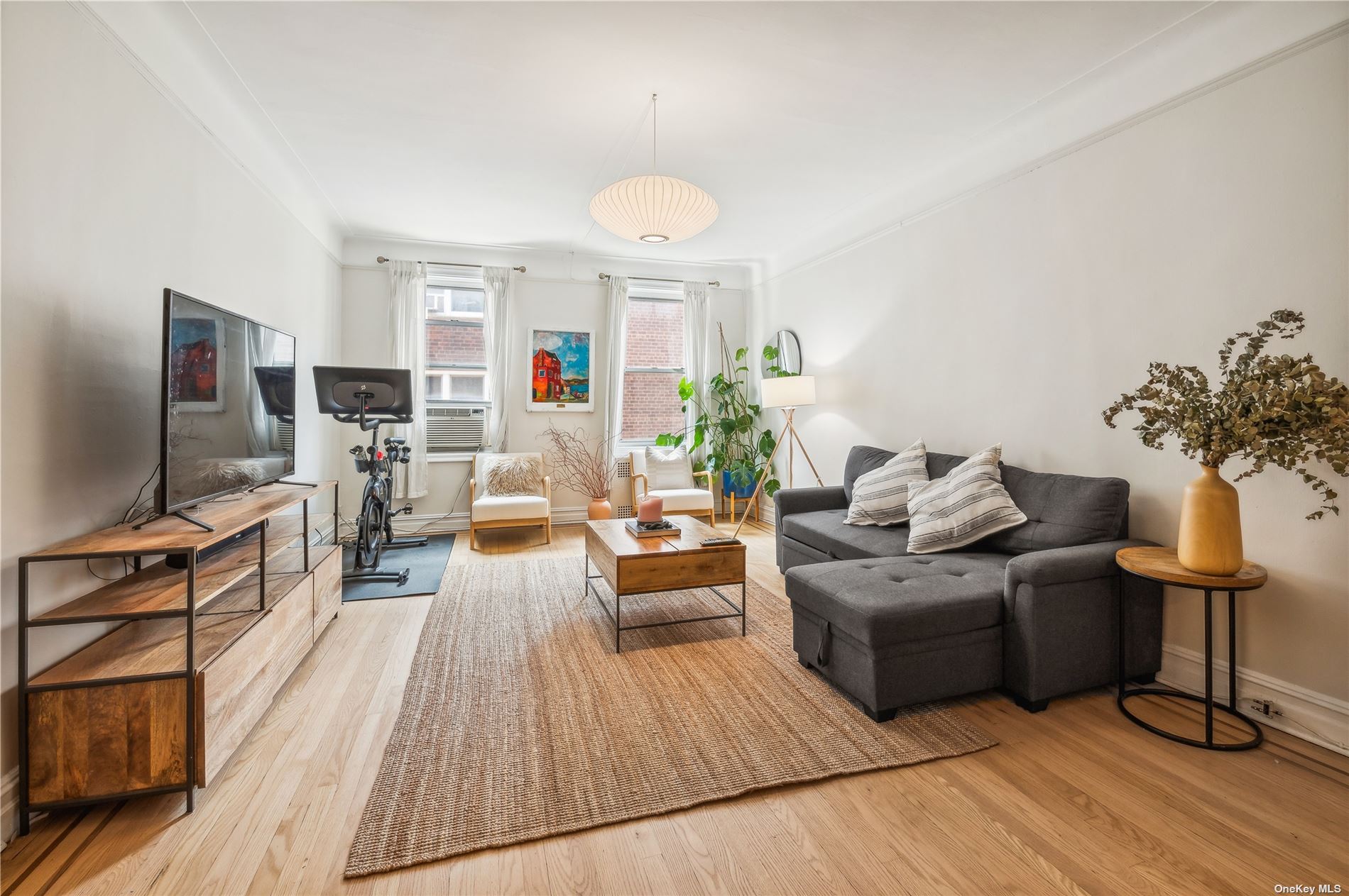 a living room with furniture fireplace and flat screen tv