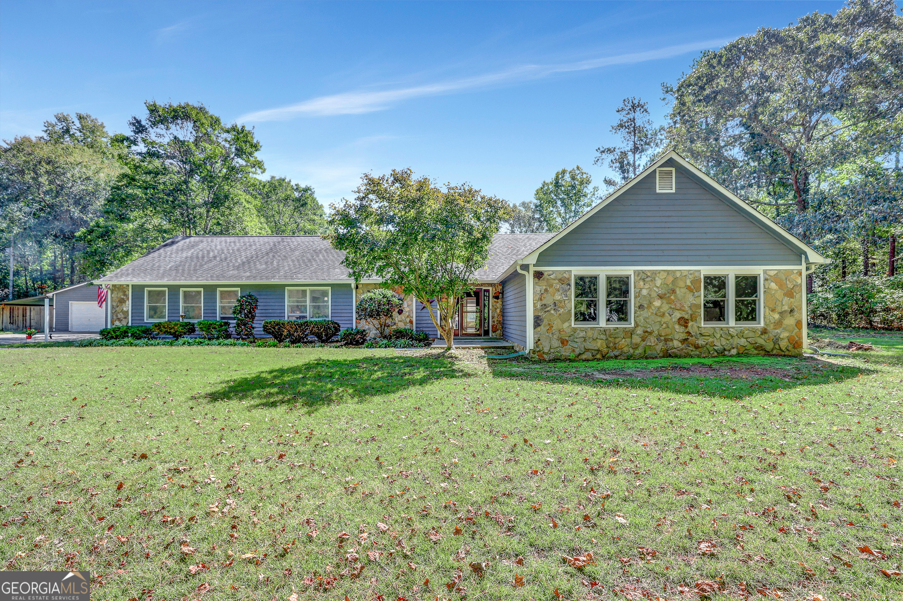 a front view of a house with garden