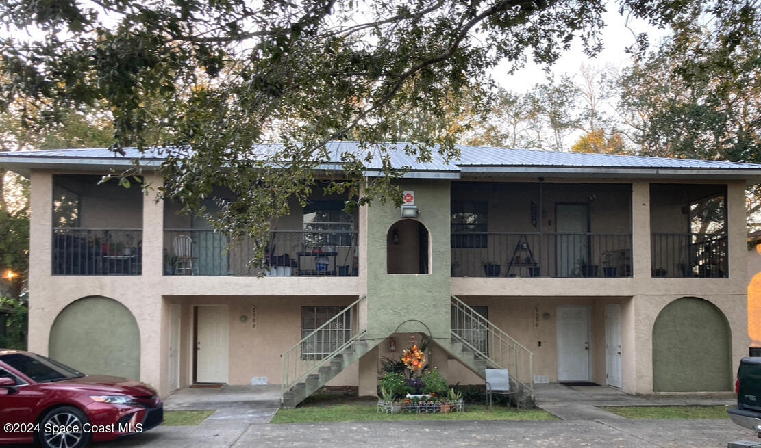 a front view of a house with parking space