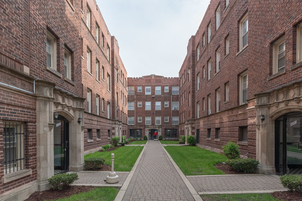 a view of a building with a yard