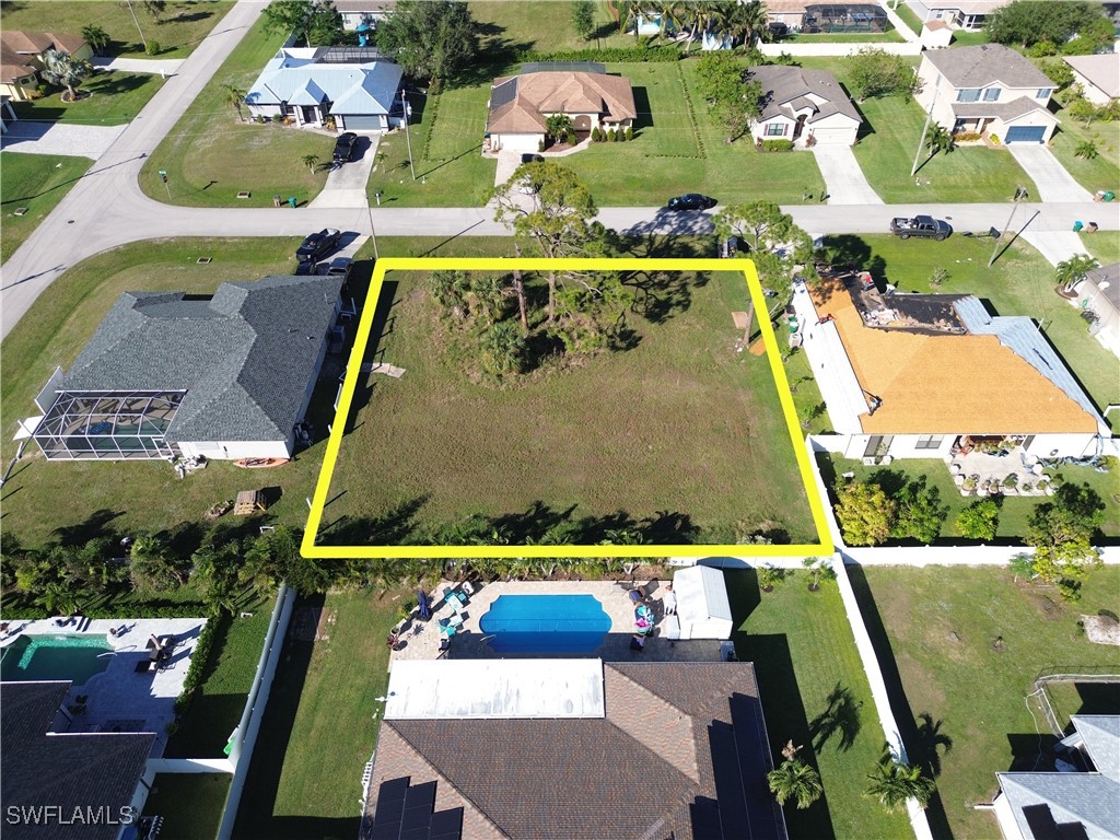 an aerial view of a pool yard swimming pool and outdoor seating