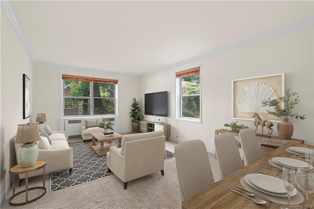 Gorgeous oversized living room with courtyard views and space for a dining area. Virtually staged.