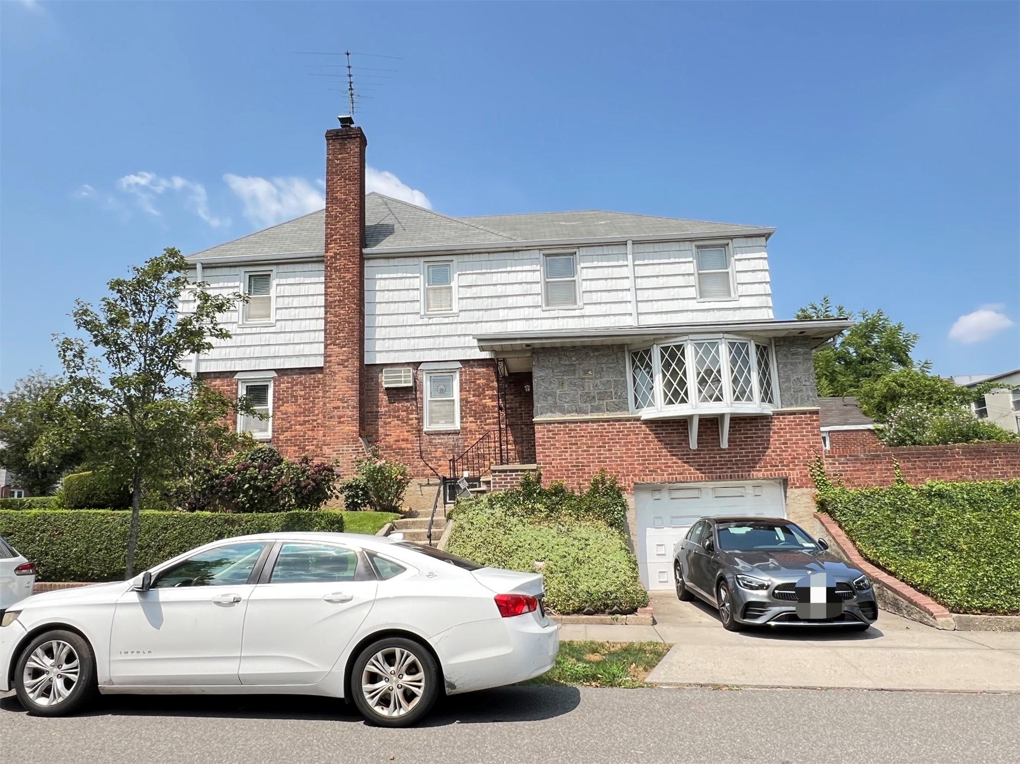 View of front of home featuring a garage