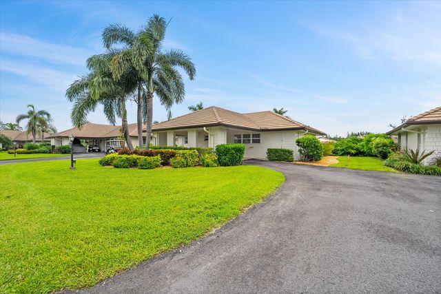 $619,000 | 320 Villa Drive South | Atlantis Country Club