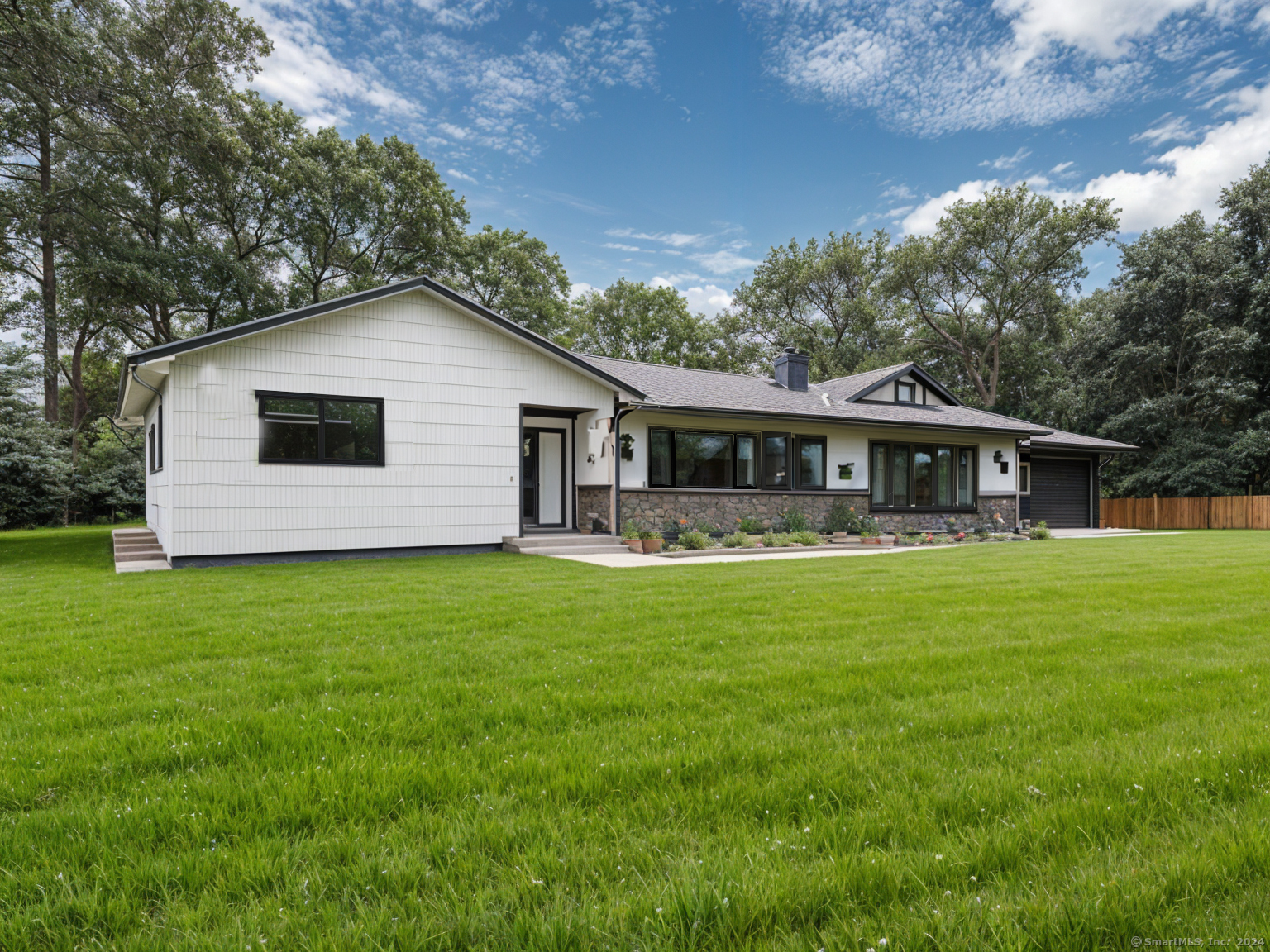 a front view of house with yard and green space