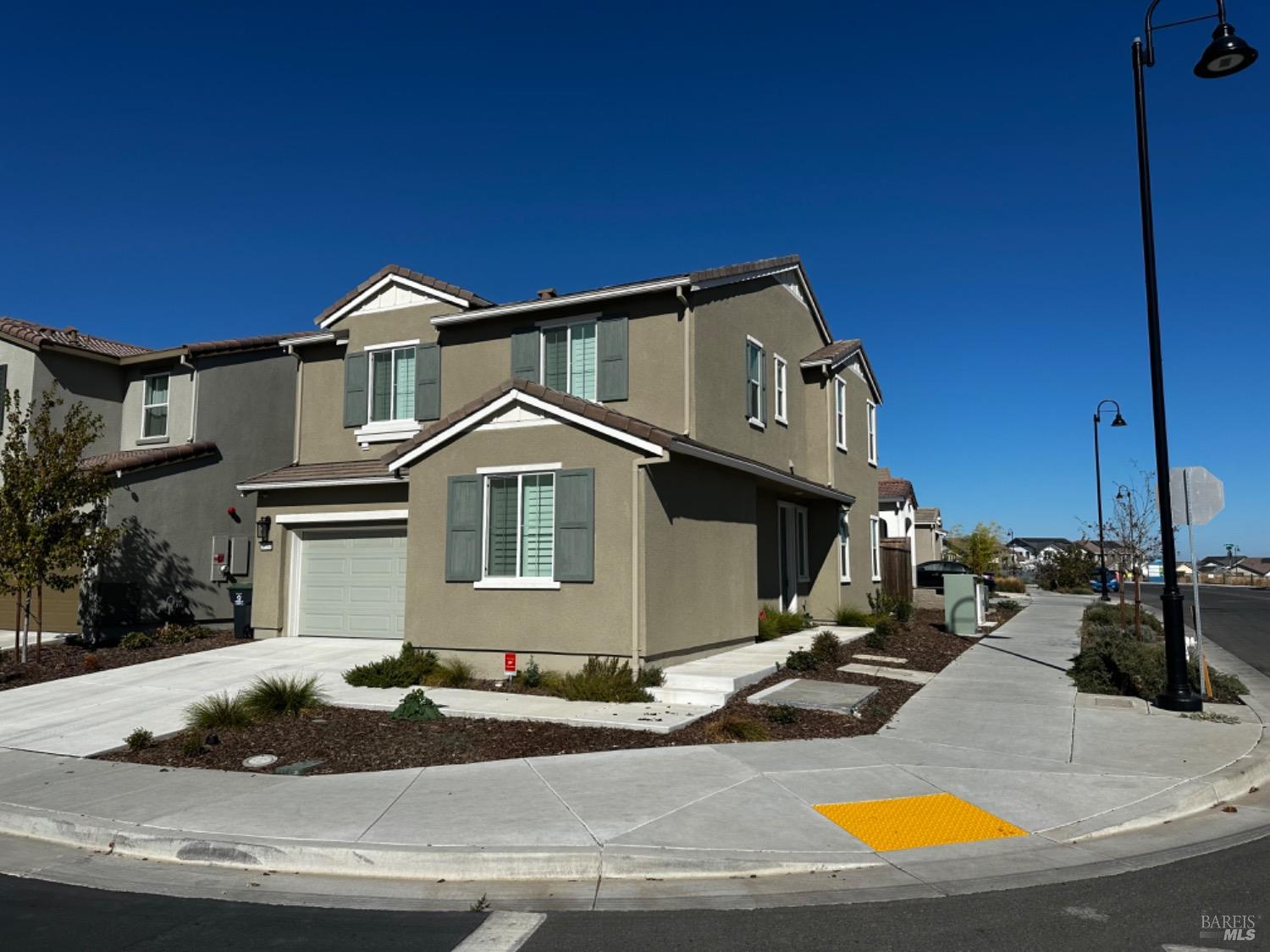 a view of a house with yard and sitting area