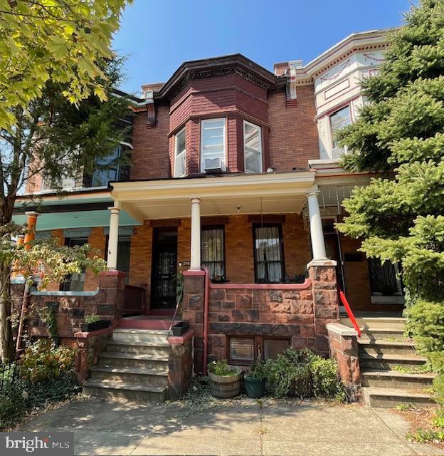 a front view of a house with a porch