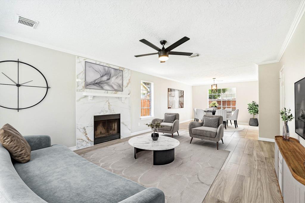 a living room with furniture and a fireplace