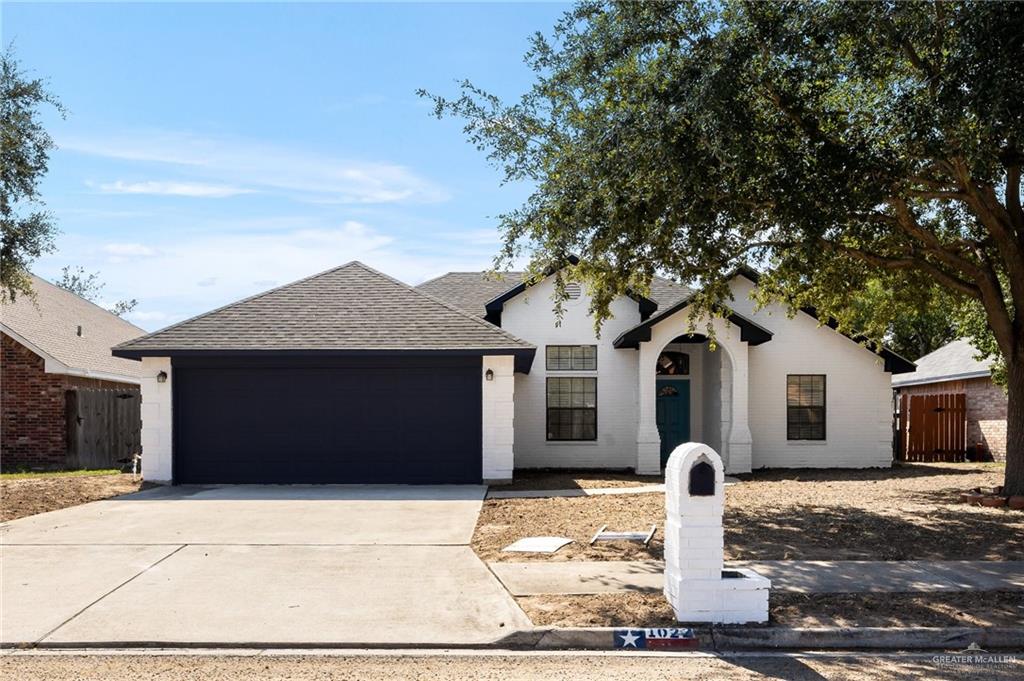 View of front of property with a garage