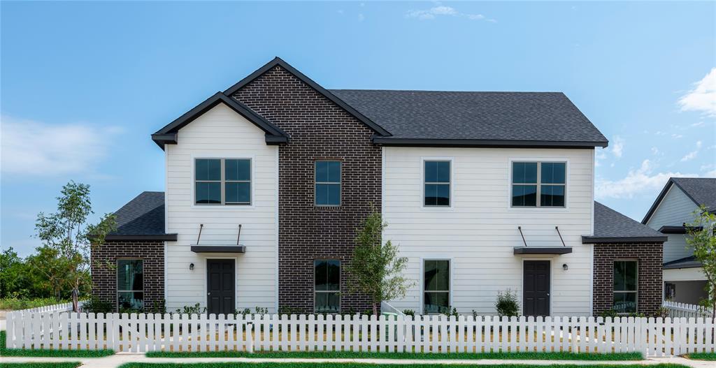 a front view of a house with a fence