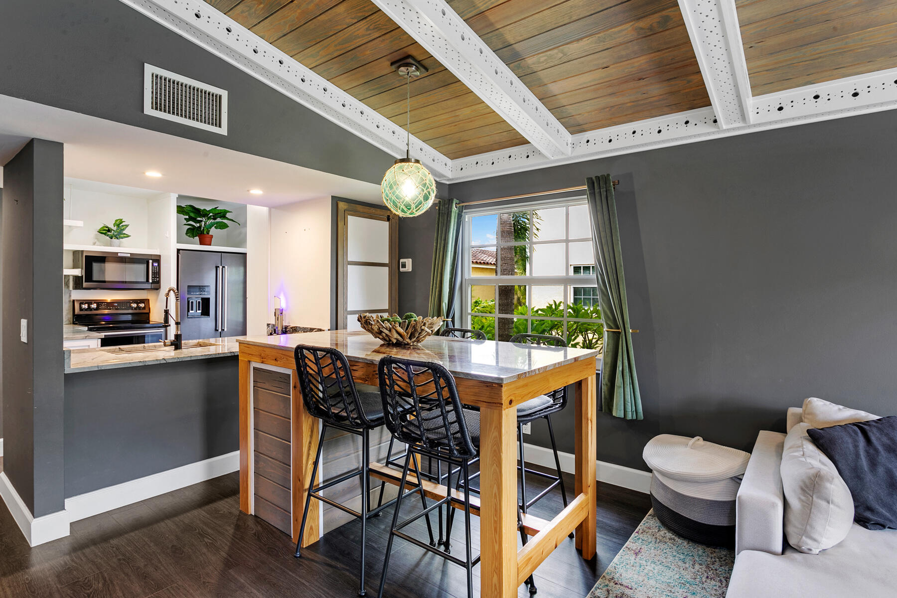 a view of a dining room with furniture window and wooden floor