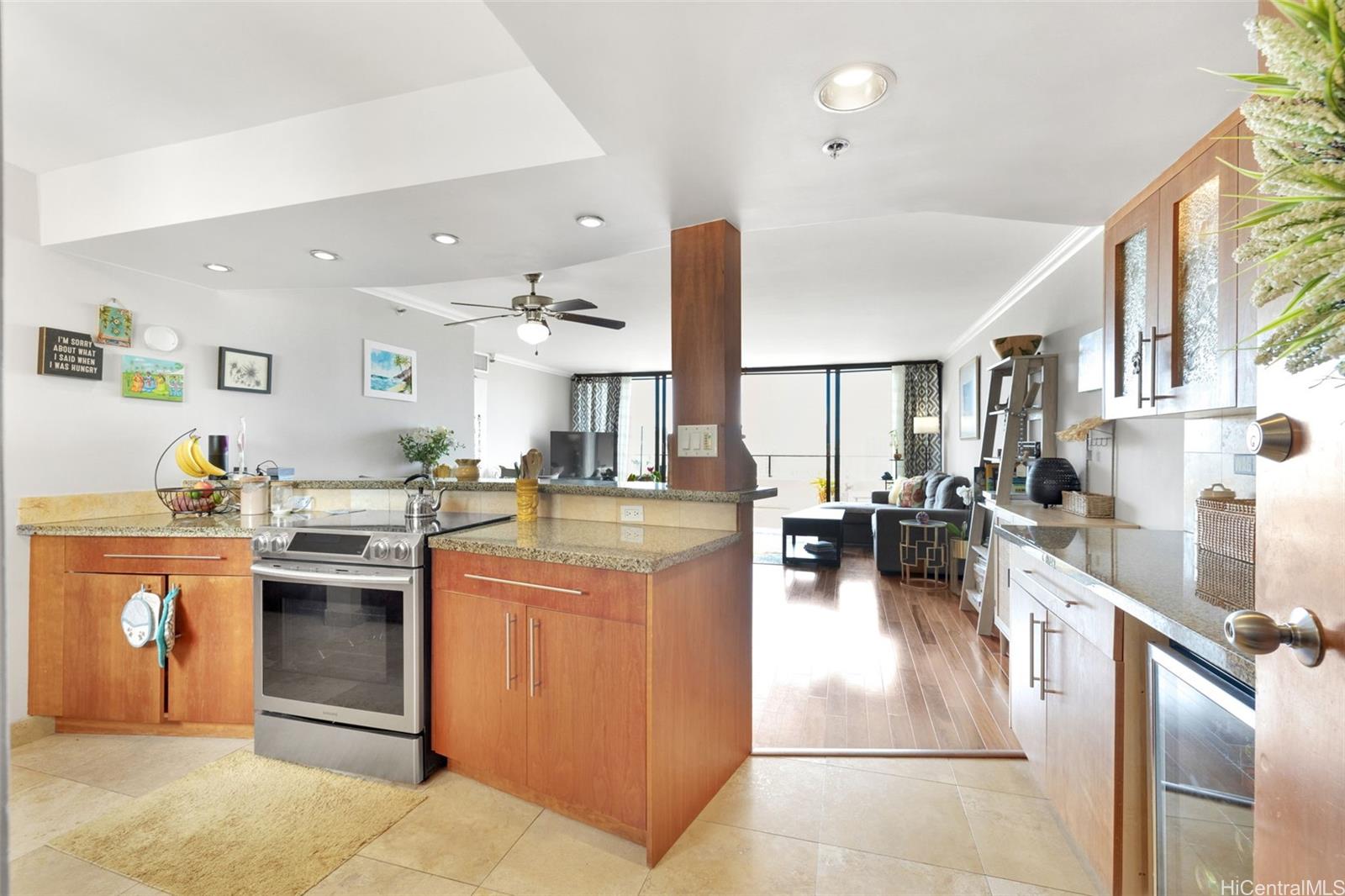 a kitchen with lots of counter top space and stainless steel appliances