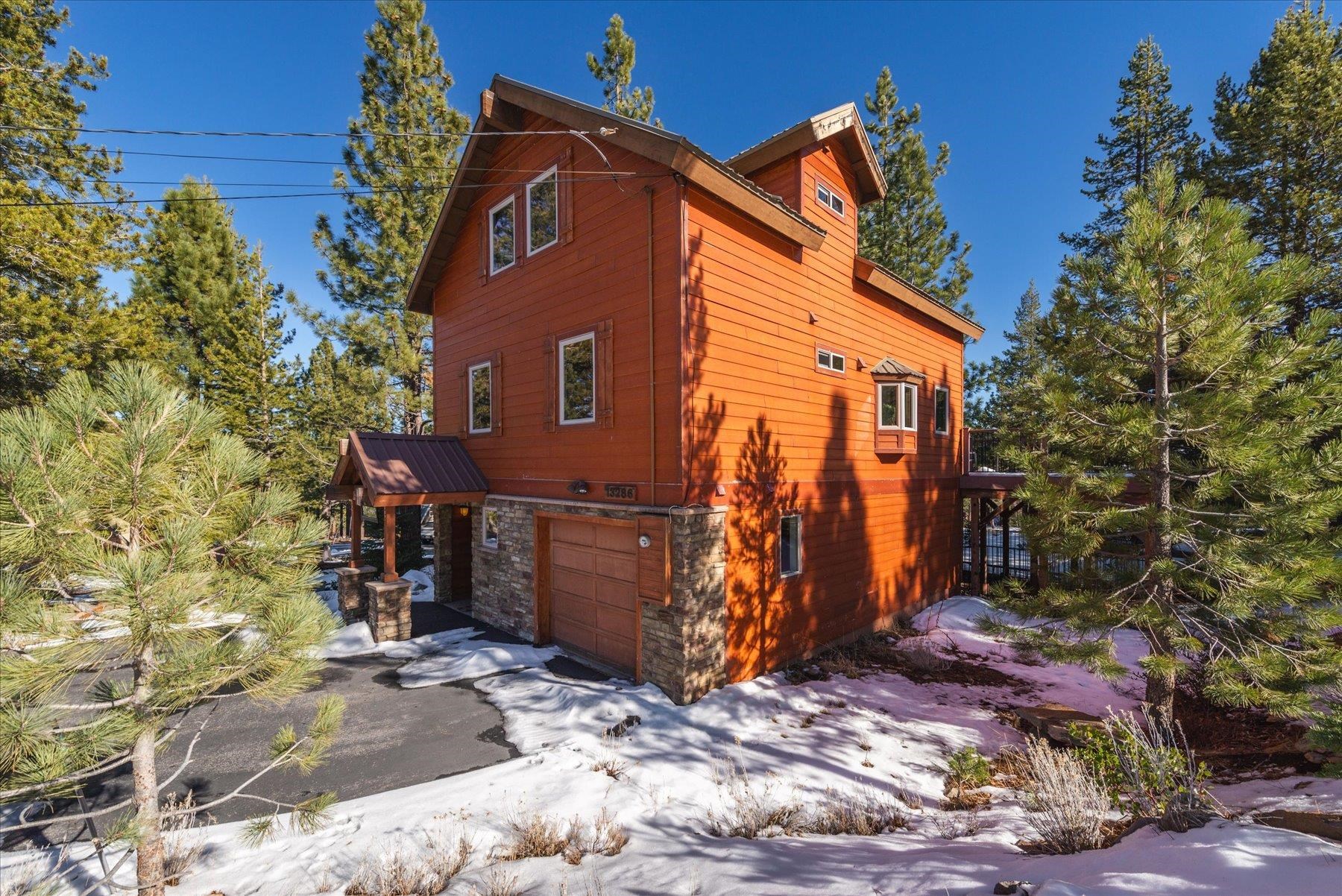 a view of a house with a tree