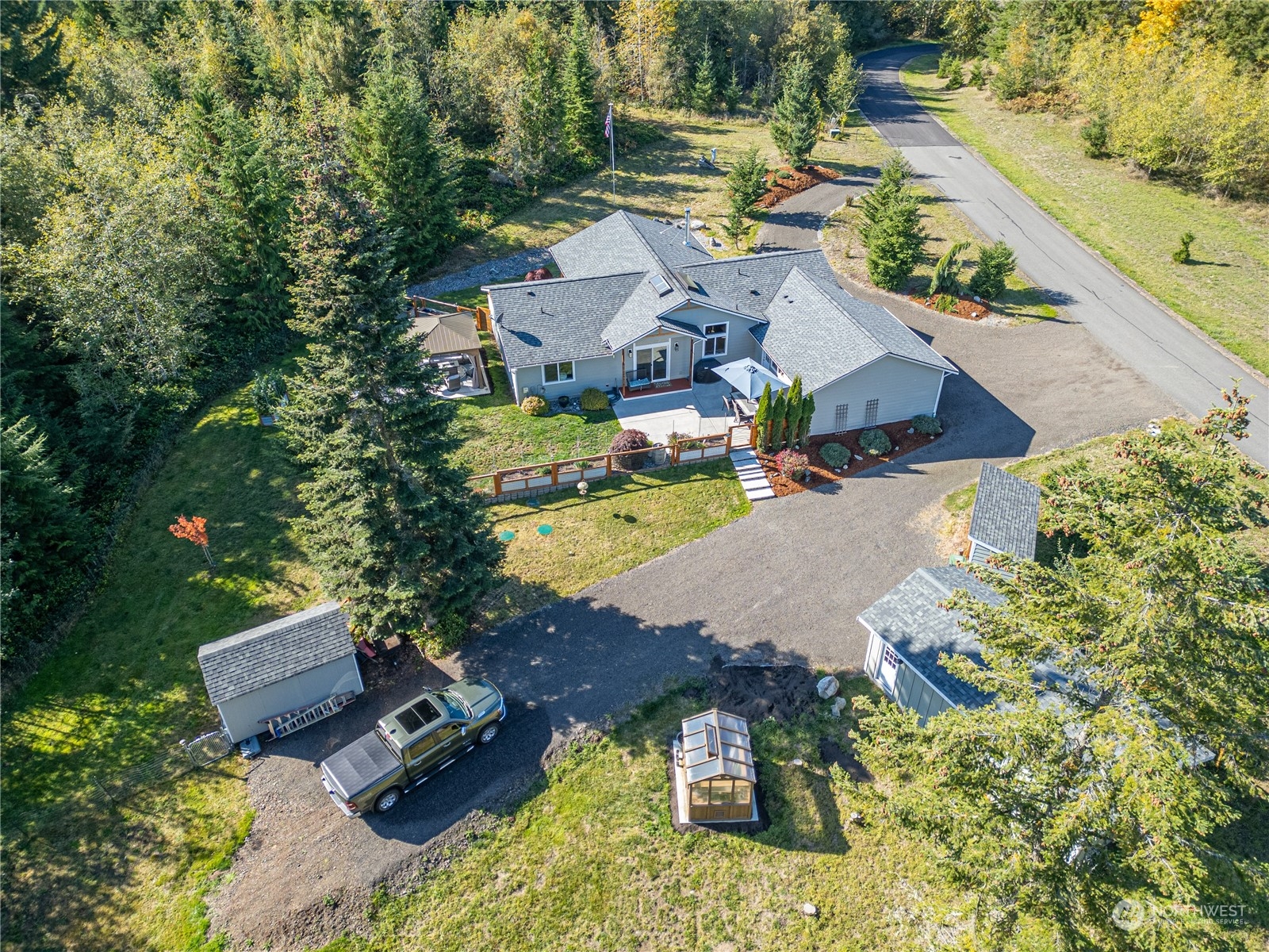 an aerial view of residential houses with outdoor space