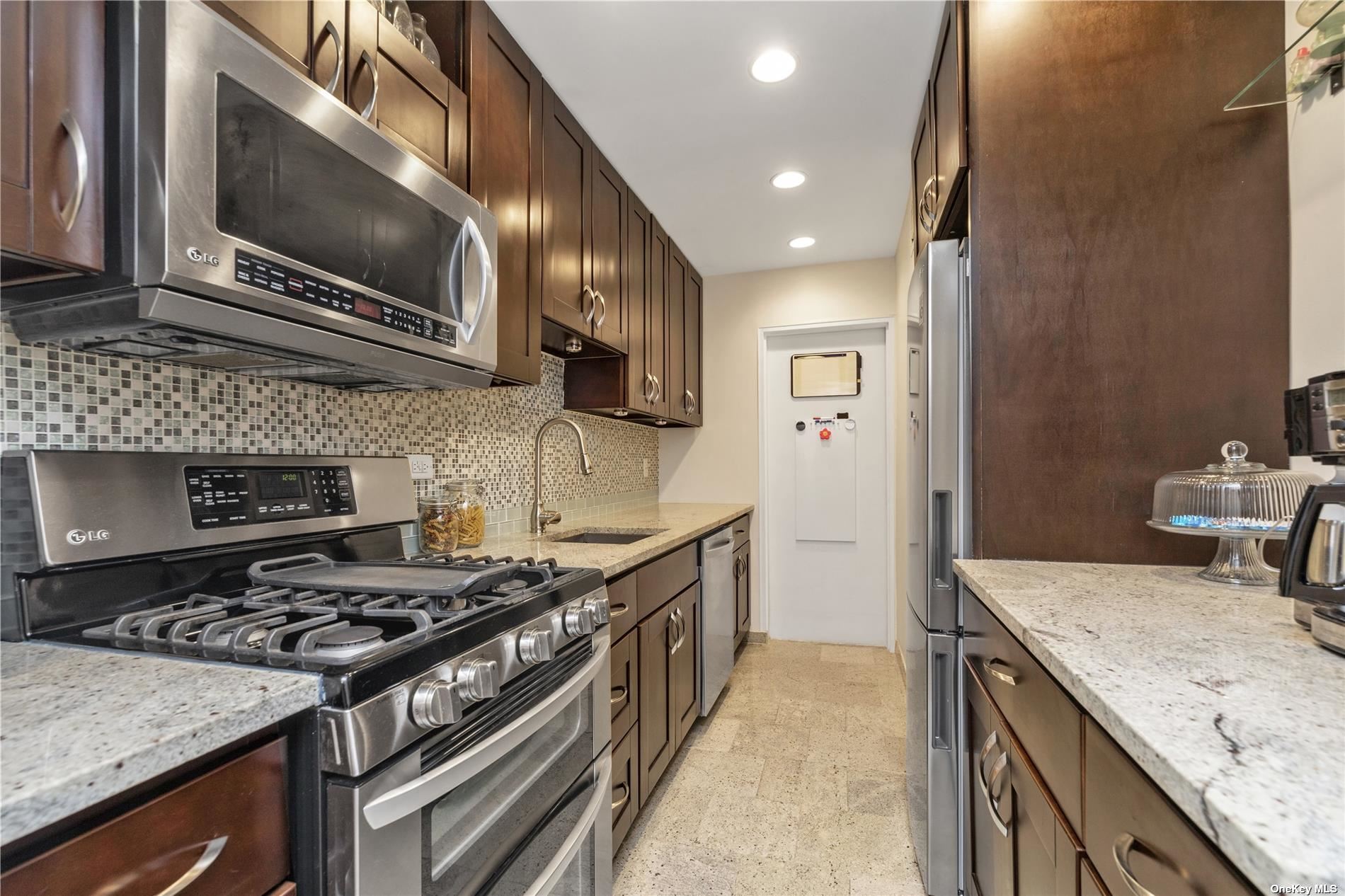 a kitchen with a stove and a sink