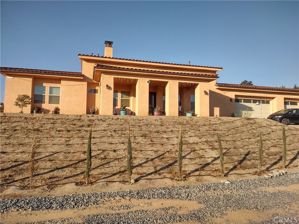 a front view of a house with a white door