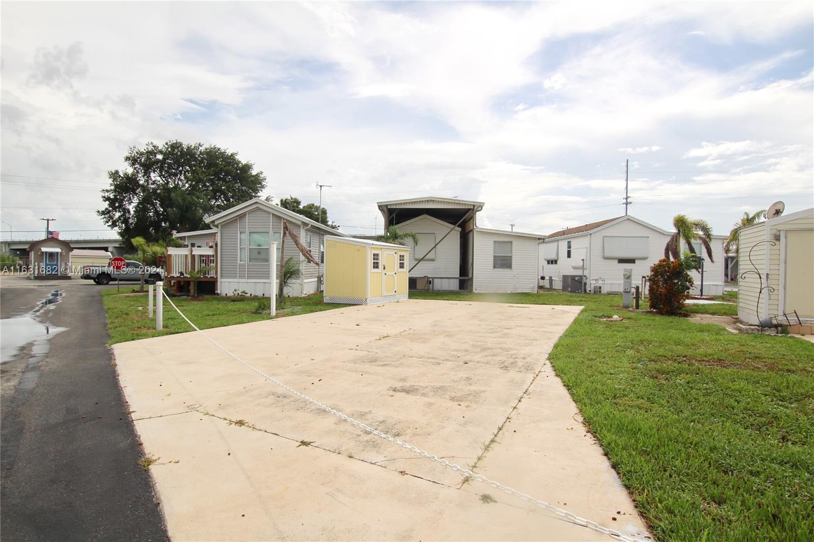 a park view with a house in the background