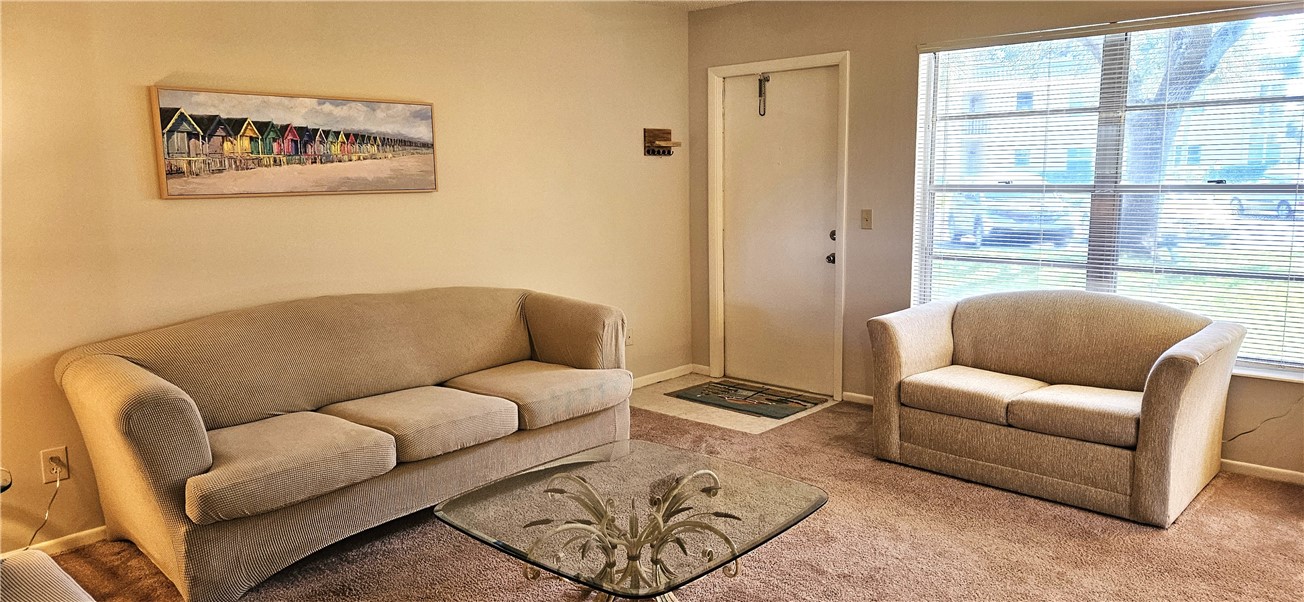 a living room with furniture and a window