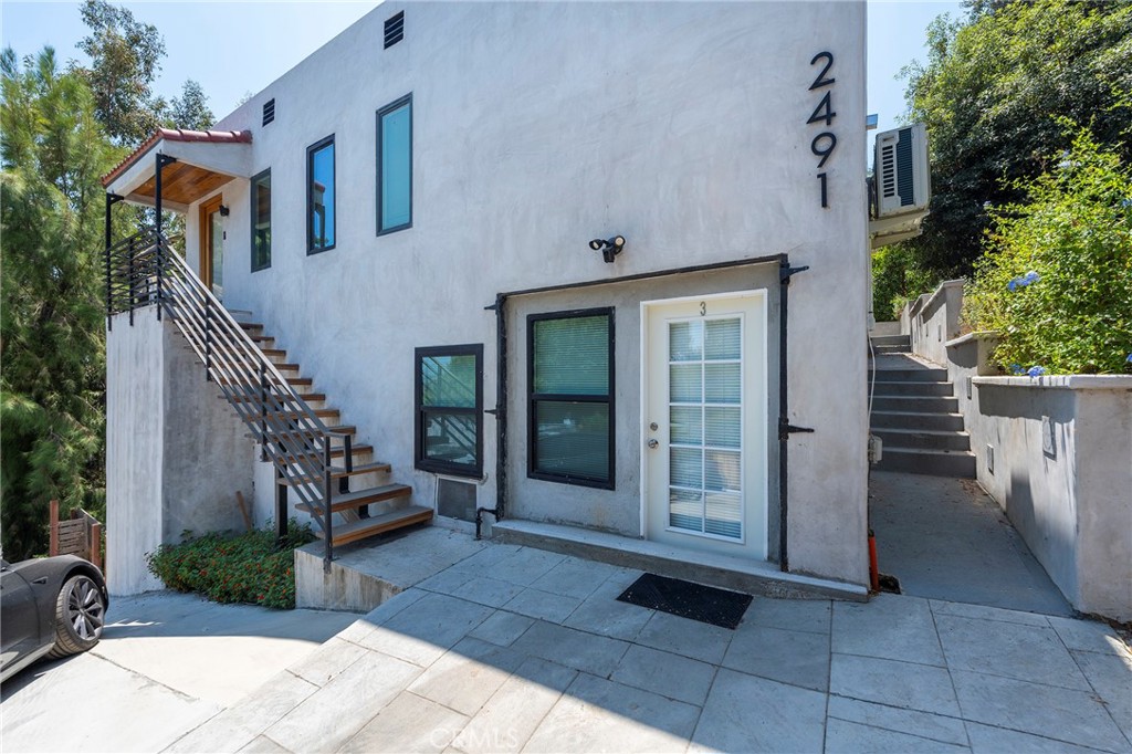 a view of a house with entryway and stairs