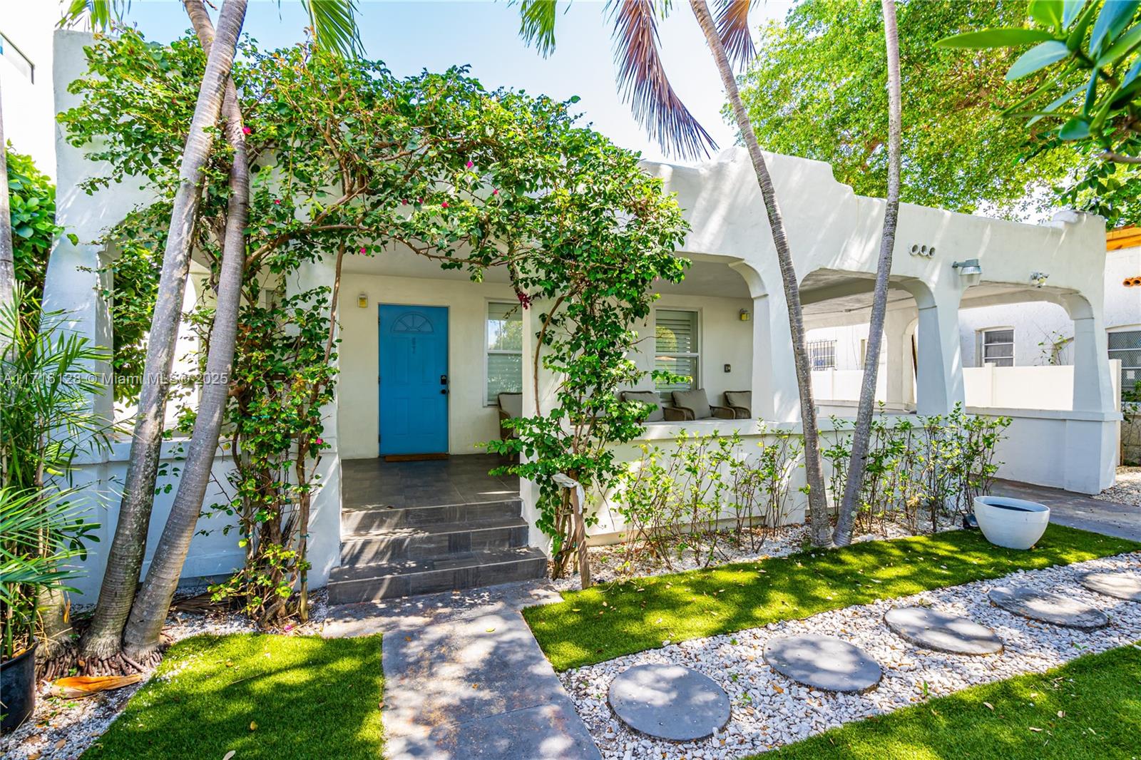 a front view of a house with garden