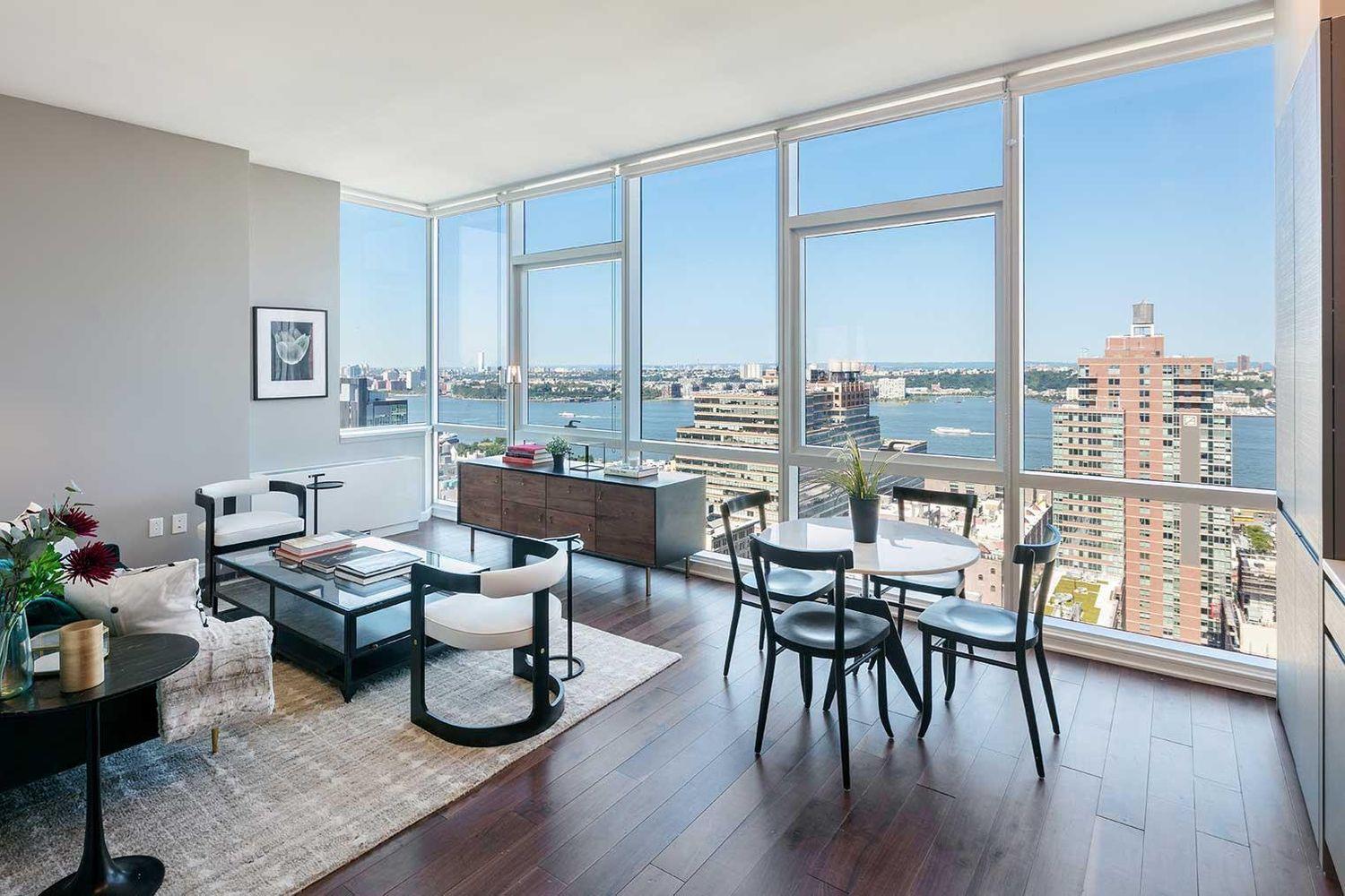 a room with furniture wooden floor and a window