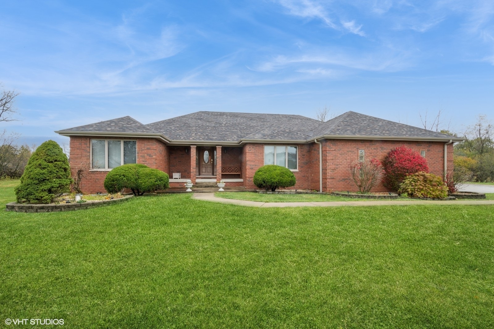 a front view of a house with garden