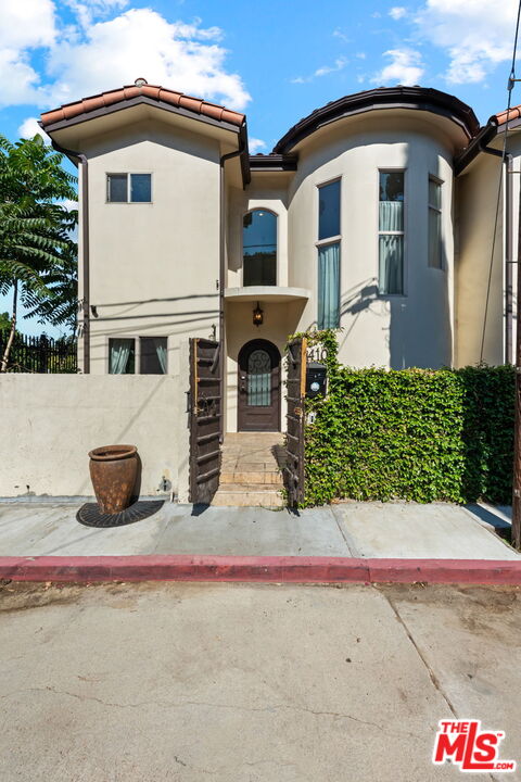 a front view of a house with garage